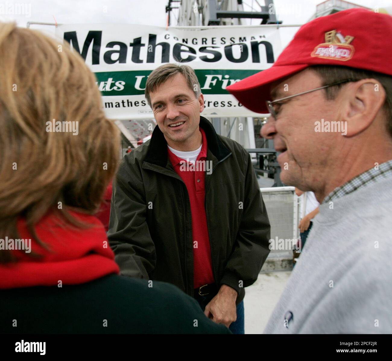 Rep. Jim Matheson, DUtah, center, campaigns outside the University of
