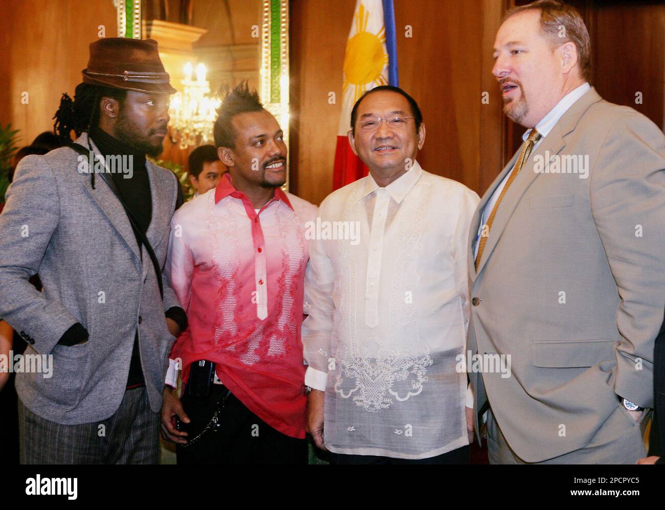 Philippine Presidential executive secretary Eduardo Ermita, second from