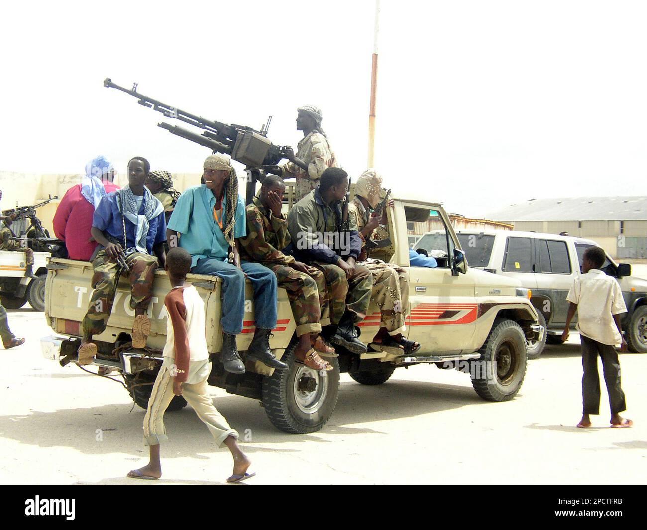 Islamic militia guard the Mogadishu seaport with an anti aircraft gun,  after they took control of the port, Wednesday, July 12, 2006. Mohamed Jama  Furuh,the deputy Ports Minister, whose militia controlled the