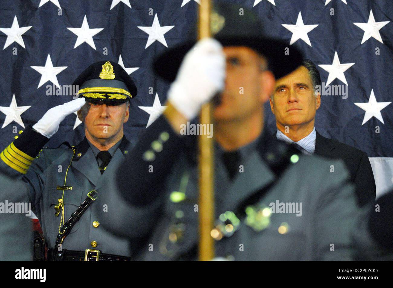 Col. Mark Delaney, left, and Massachusetts Gov. Mitt Romney, right