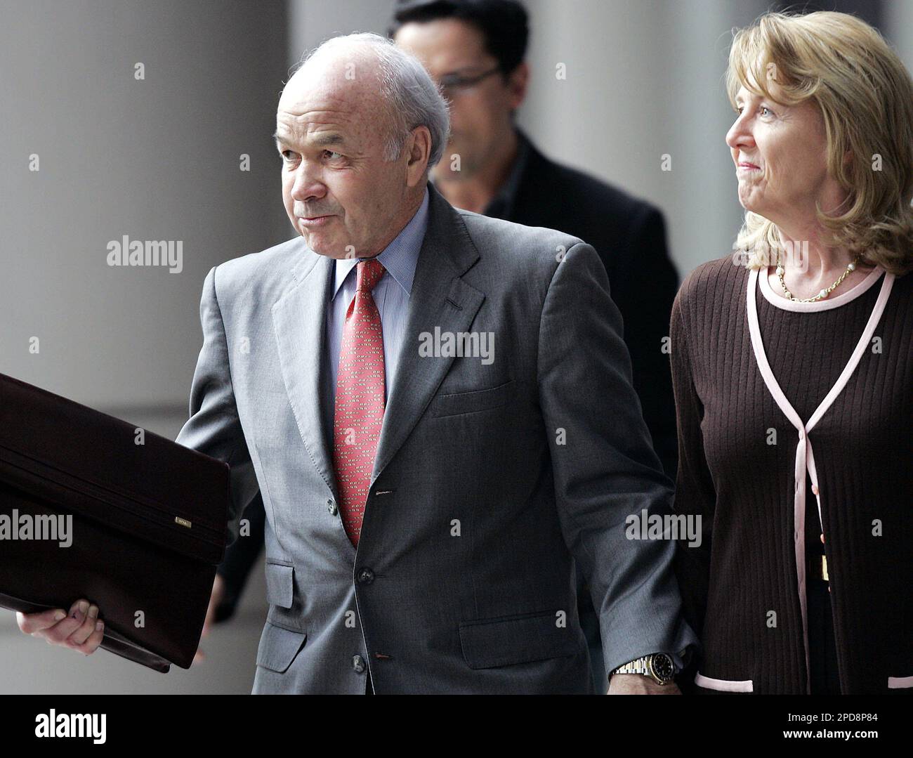 Enron founder Ken Lay, left, and his wife Linda, leave the federal
