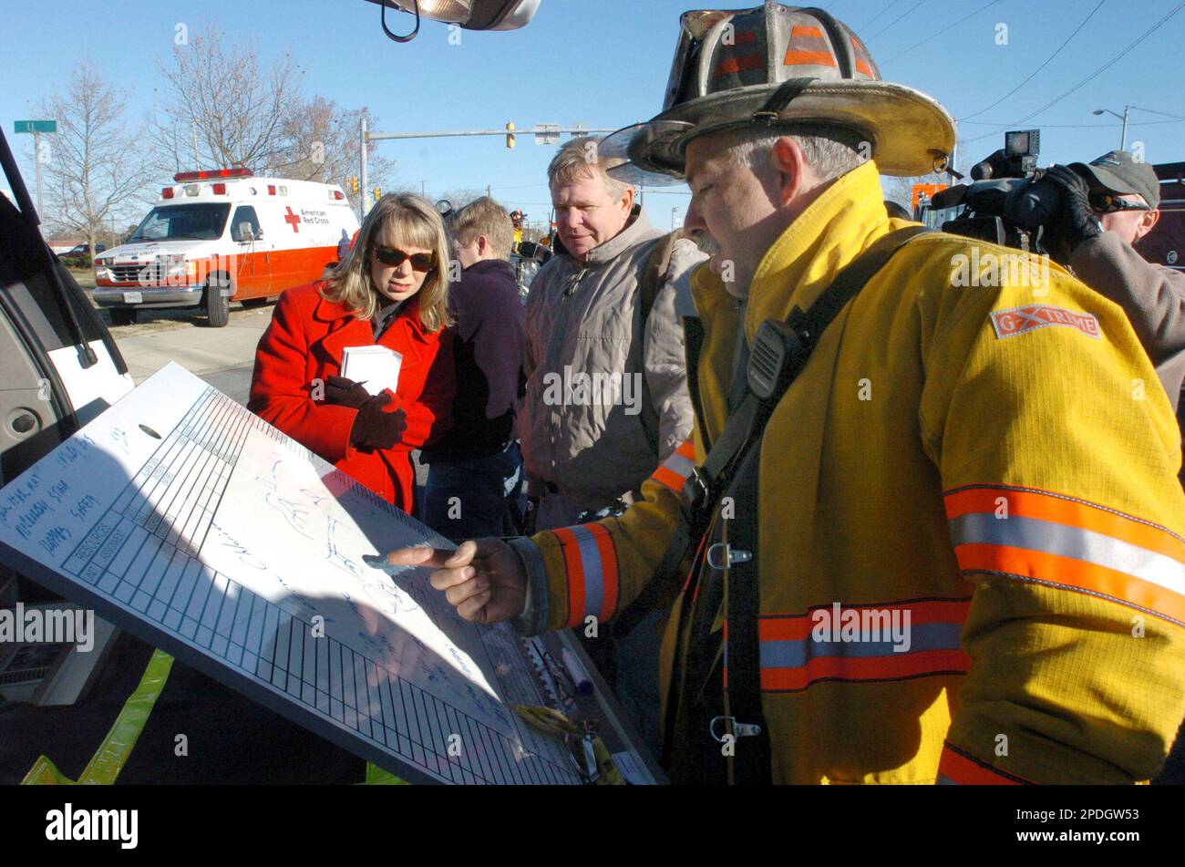 Salisbury Fire Department Assistant Chief Bryan Records, right, talks