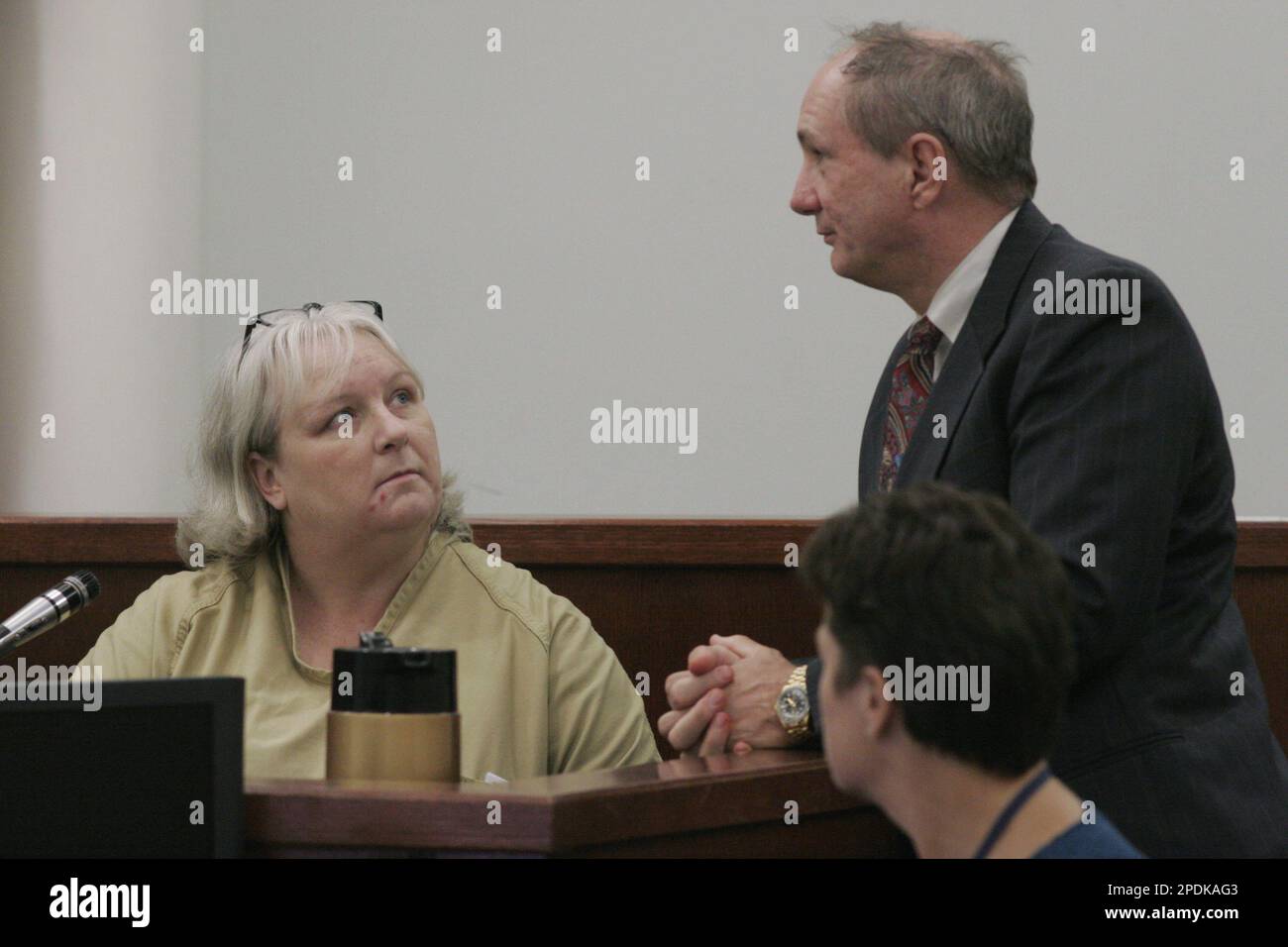 Kathleen Latimer, with lawyer Danny Burns at her side, takes the stand