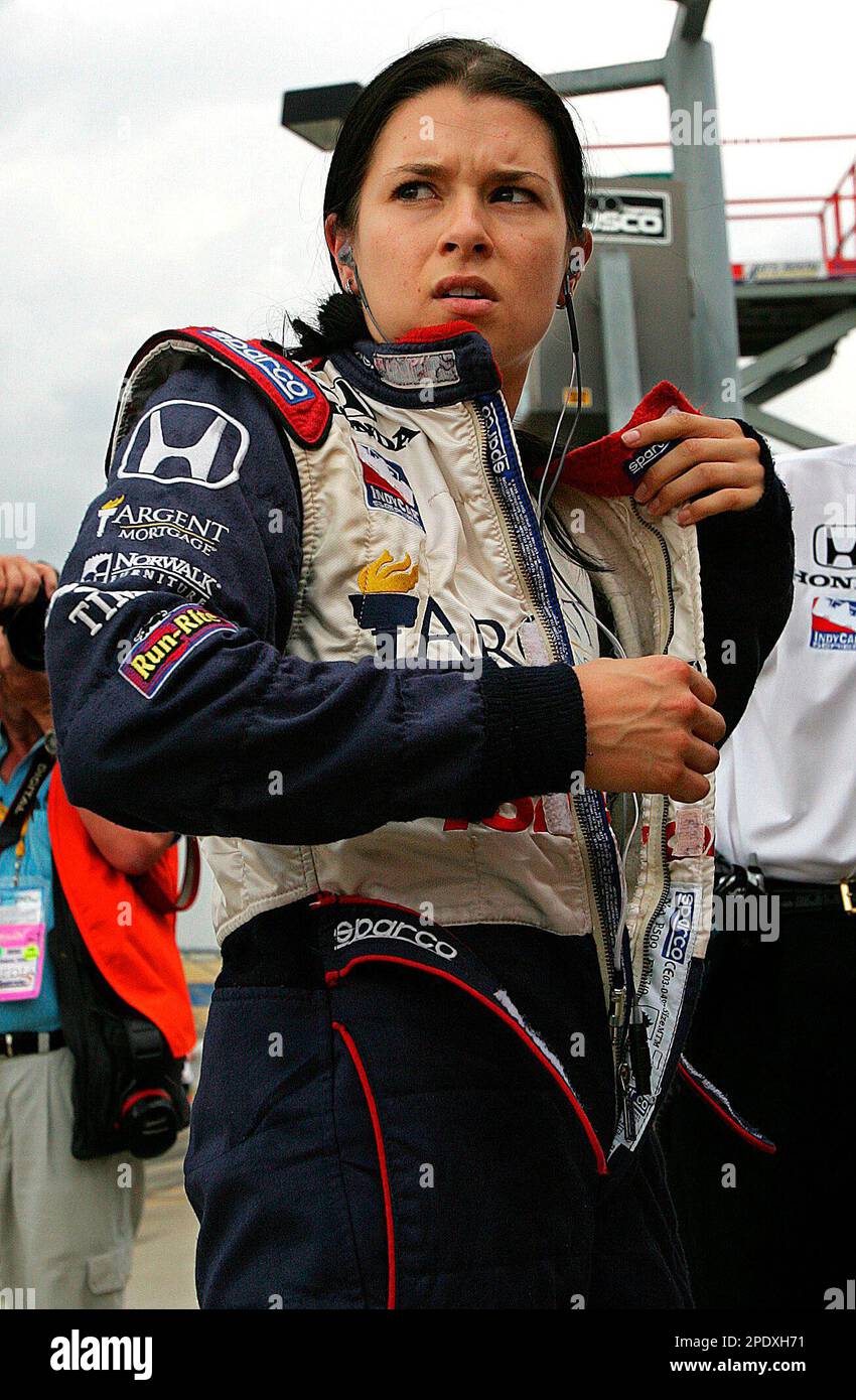 ** FILE ** Danica Patrick looks toward the track before the beginning of qualifications for the IRL Amber Alert Portal Indy 300 at Kentucky Speedway on Saturday, Aug. 13, 2005, in Sparta, Ky. From billboards to full-page adds, Patrick's image is everywhere as the rookie sensation prepares to make her first appearance in Colorado at this weekend's Honda Indy 225. (AP Photo/Ed Reinke,file) Banque D'Images