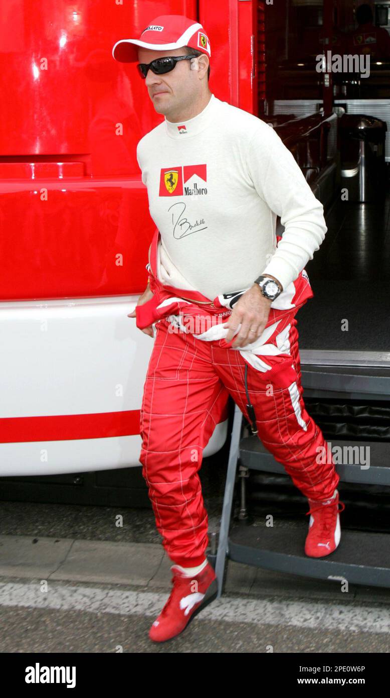 Brazil's Formula One driver Rubens Barrichello leaves the Ferrari motorhome on his way to a practise session for the Formula One Grand Prix of Germany on the Hockenheim race circuit, southern Germany, Saturday, July 23, 2005. The race will be held on Sunday, July 24, 2005. (AP Photo/Thomas Kienzle) Banque D'Images