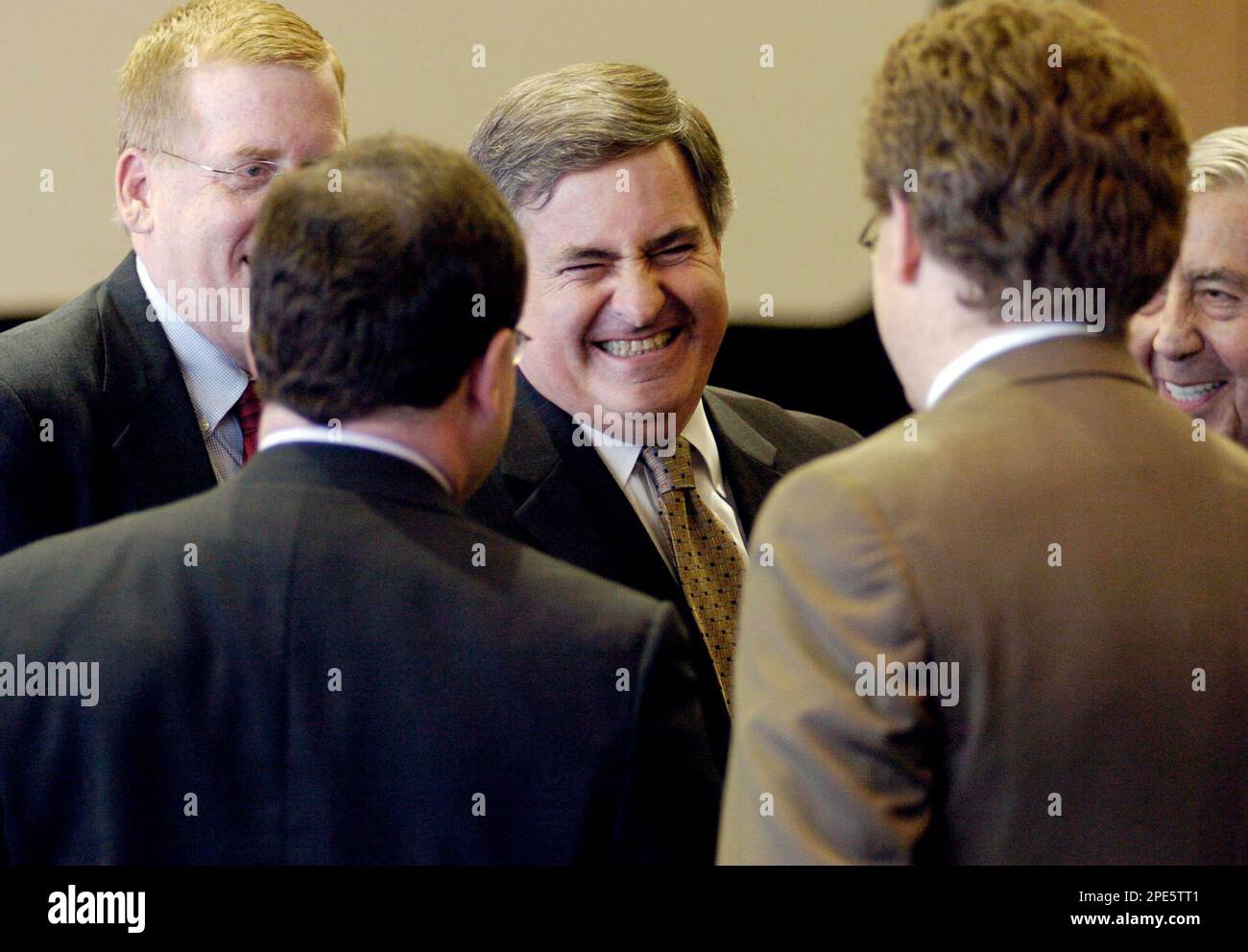 Coleman Parent Holdings' lead counsel Jack Scarola, center, surrounded by co-counsel, reacts to the jury verdict in favor of his client Ronald Perelman against Morgan Stanley Monday, May 16, 2005, in West Palm Beach, Florida. A Florida jury awarded billionaire investor Perelman $604.3 million in damages on his claims that Morgan Stanley defrauded him as part of the 1998 sale of his controlling stake in Coleman Co. to Sunbeam Corp. (AP Photo/Pool, Mark Elias) Banque D'Images