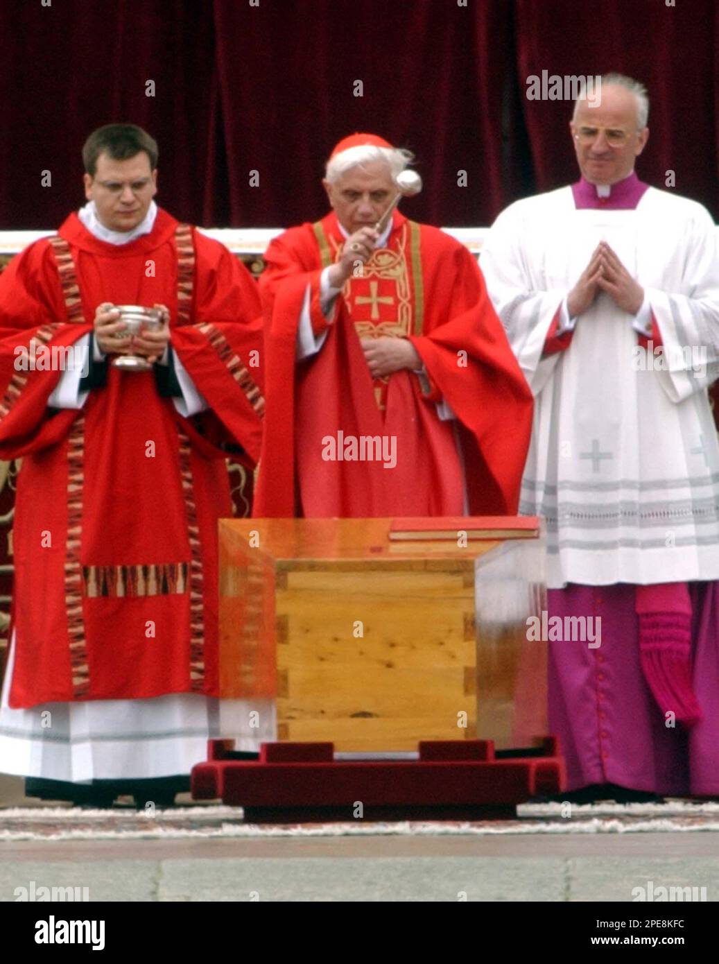 Cardinal Joseph Ratzinger, center, blesses the coffin containing the ...