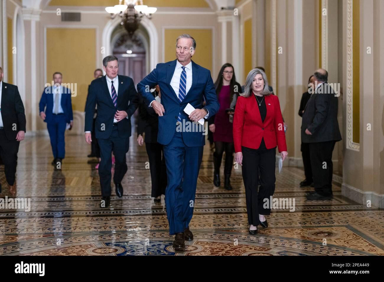 Senate Minority Whip John Thune, RS.D., center, is flanked by Sen