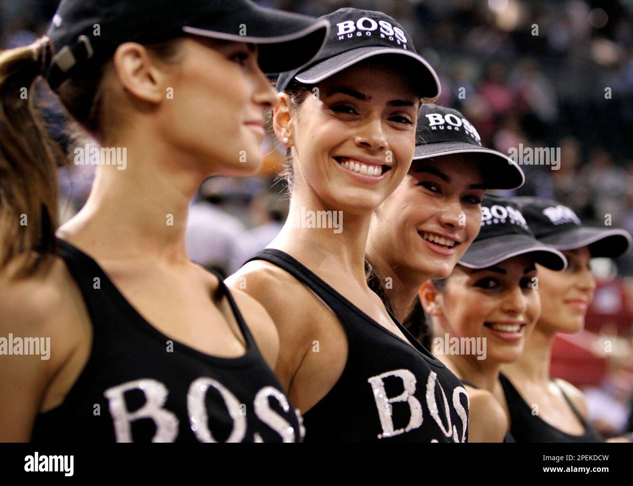 Models who are replacing the traditional ball boys smile as they line up before departing the court after the match of U.S. tennis players Andre Agassi and Vincent Spasea during the ATP Masters series tennis tournament in Madrid, Thursday, Oct. 21, 2004. (AP Photo Jasper Juinen) Banque D'Images