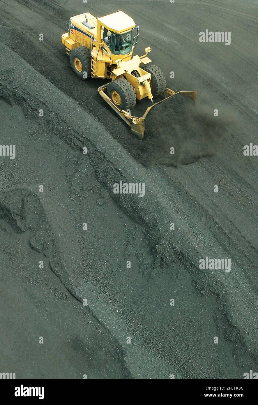 Coal handler Russ Dickerson, of rural Boone County, Iowa, uses a