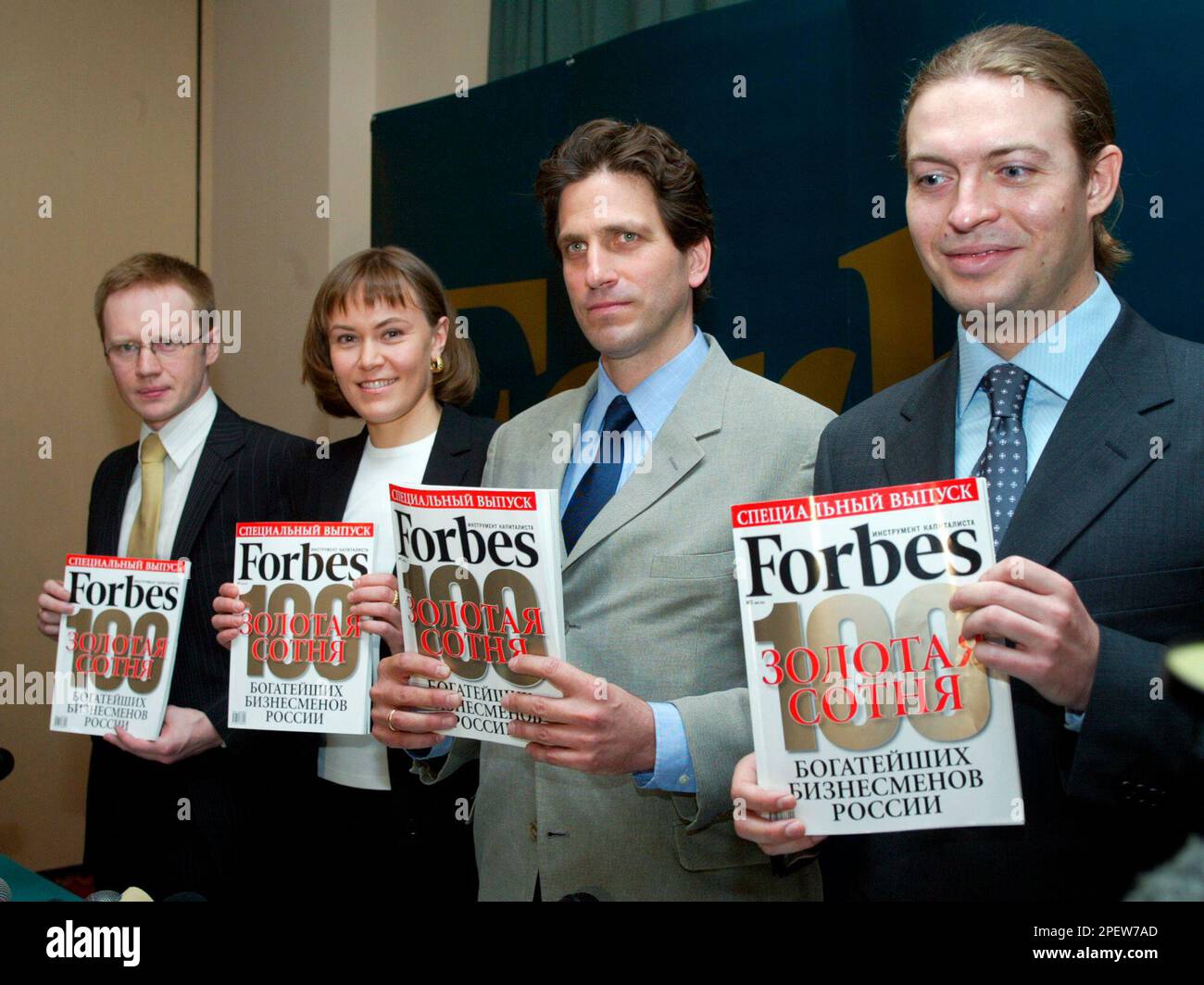 The editor of Forbes Magazine's Russian edition Paul Klebnikov, 2nd from right, and the edition's deputy chief Kirill Vishnekovsky, right, pose at a news conference to mark the edition of the Forbes