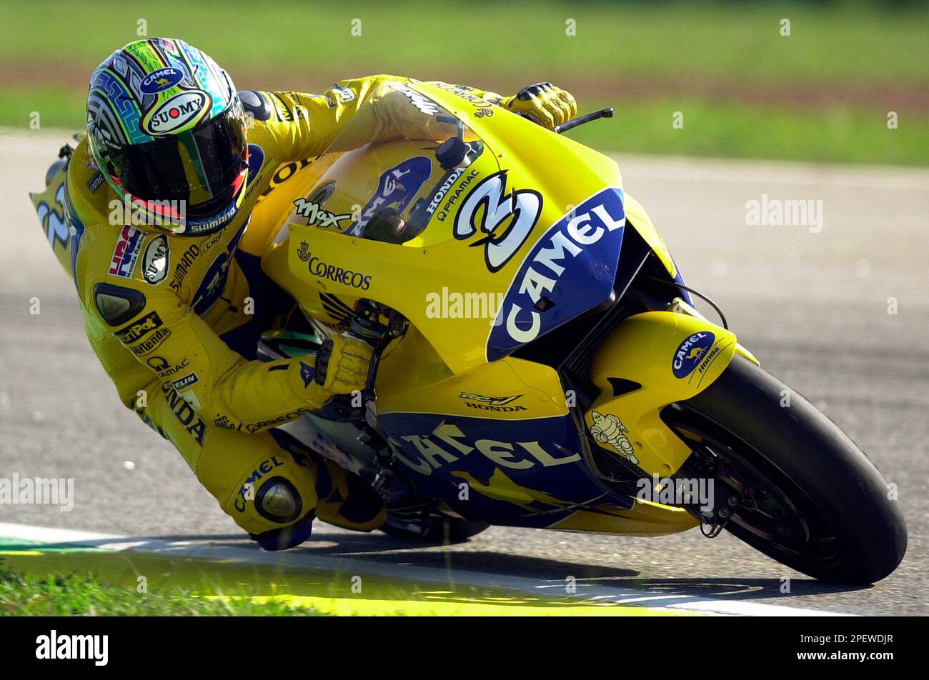 Moto GP rider Max Biaggi, of Italy, rides his Honda at the Nelson Piquet race track in Rio de Janeiro, Brazil, on Saturday, July 3, 2004. The 2004 Rio Motorcycle Grand Prix will take place on Sunday, July 4. (AP Photo/Renzo Gostoli) Banque D'Images