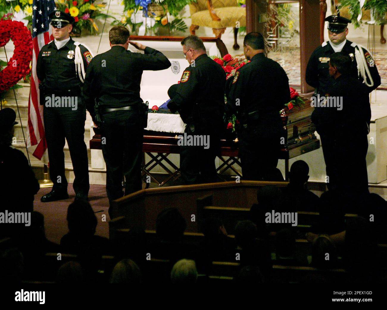 Sergeant Greg Raco Grand Praire police officers file past the casket of Sgt. Gregory Lee ...