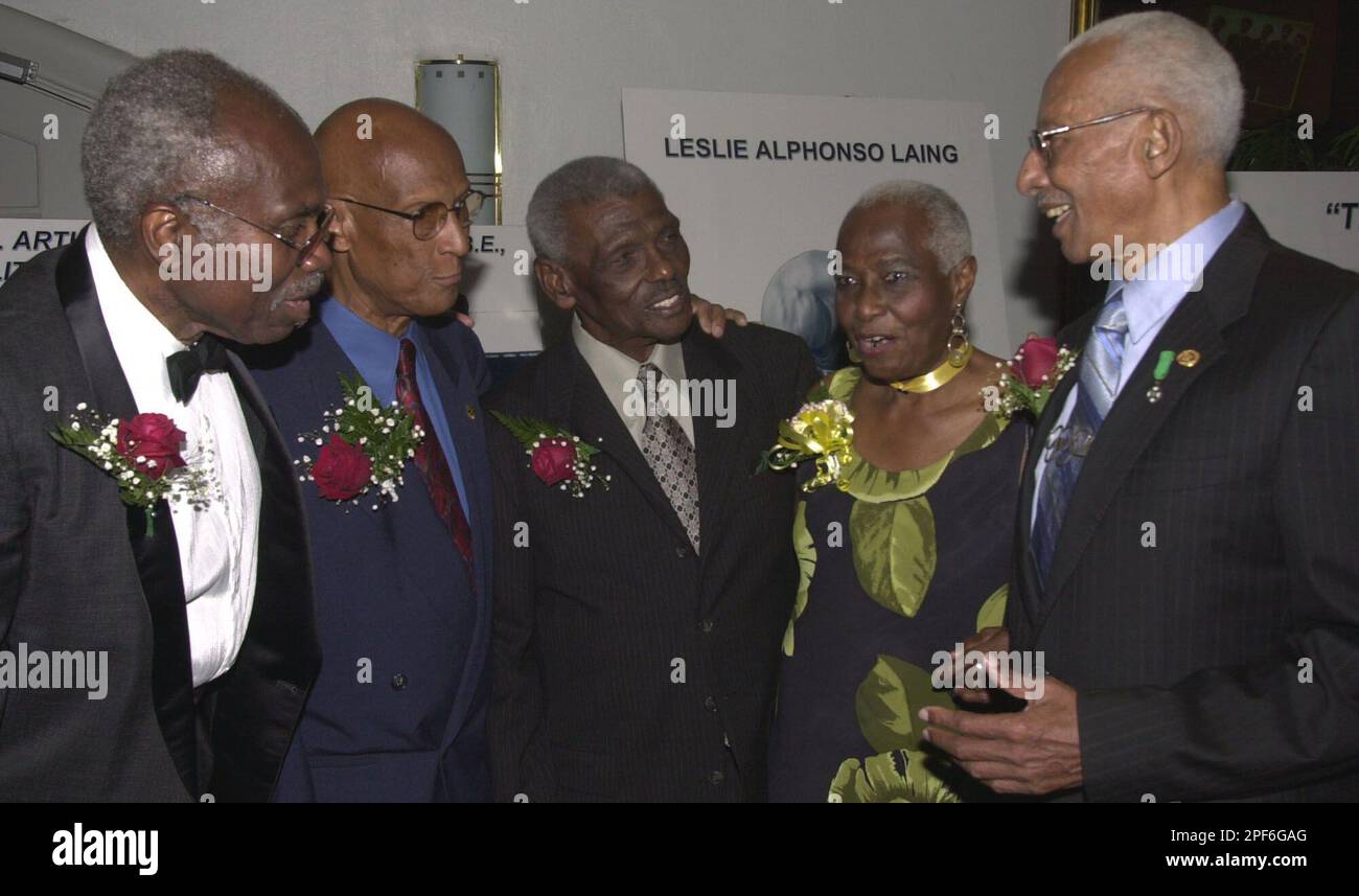 Herb McKenley ( first from right) shares a light moment with other