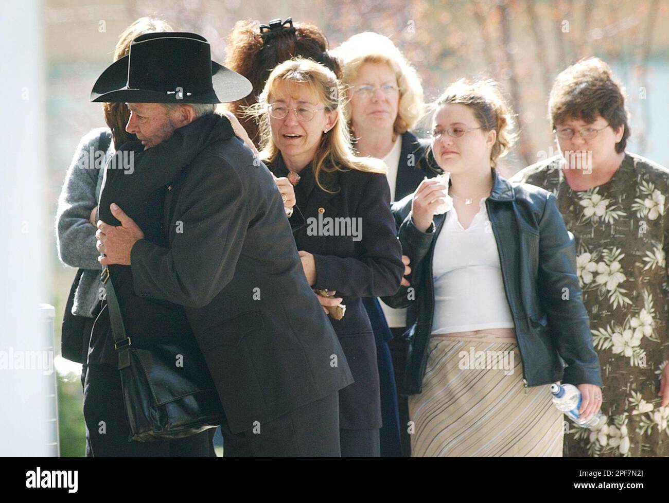 Edward Bohr, left, gets hug as he walks in to the St. Francis de Sales