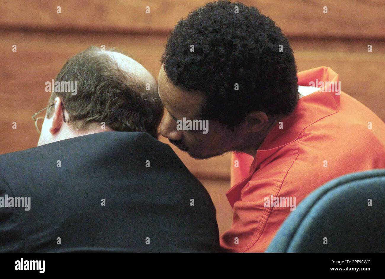 Sniper suspect John Allen Muhammad, right, confers with his attorney