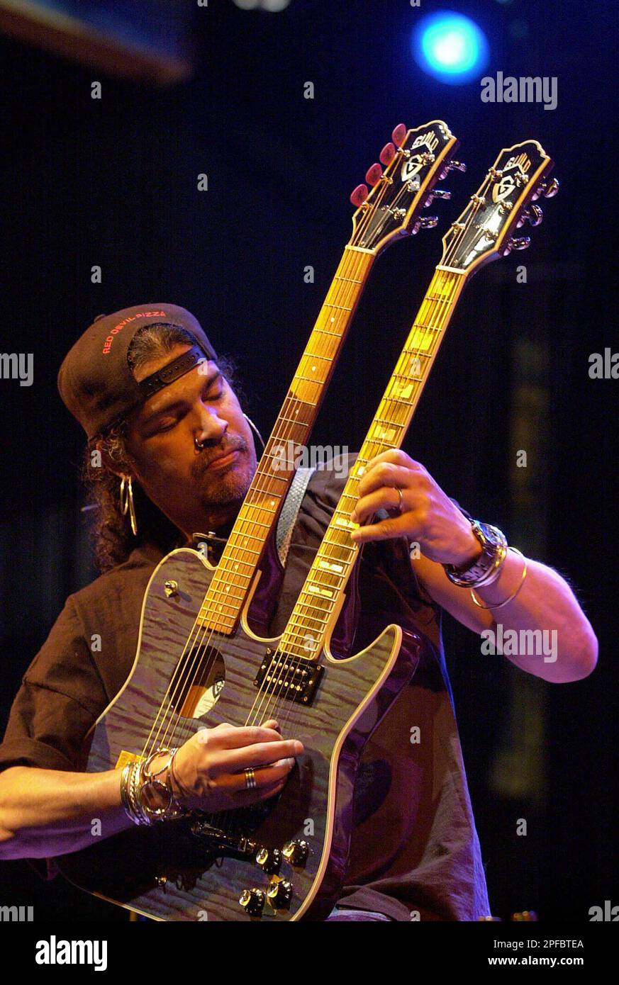 Former Guns N' Roses guitarist, Slash, does a guitar solo during a