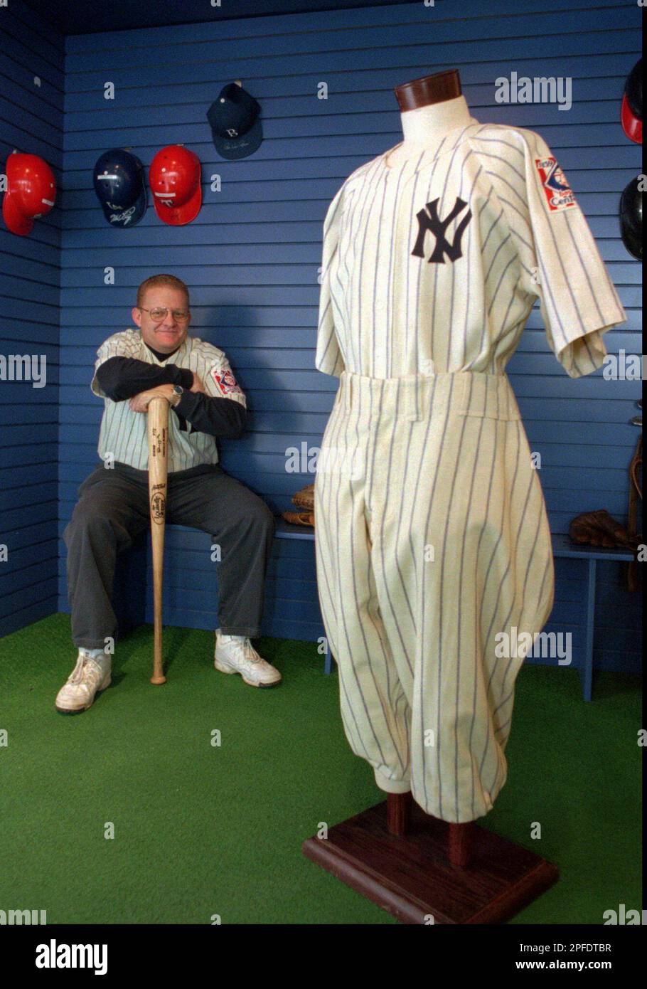 Curt Boster displays the New York Yankess uniform worn by Lou Gehrig