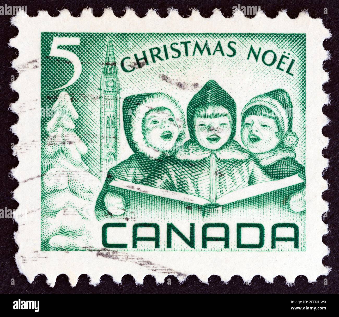 CANADA - VERS 1967 : un timbre imprimé au Canada dans le numéro de Noël montre Carol Singers, vers 1967. Banque D'Images