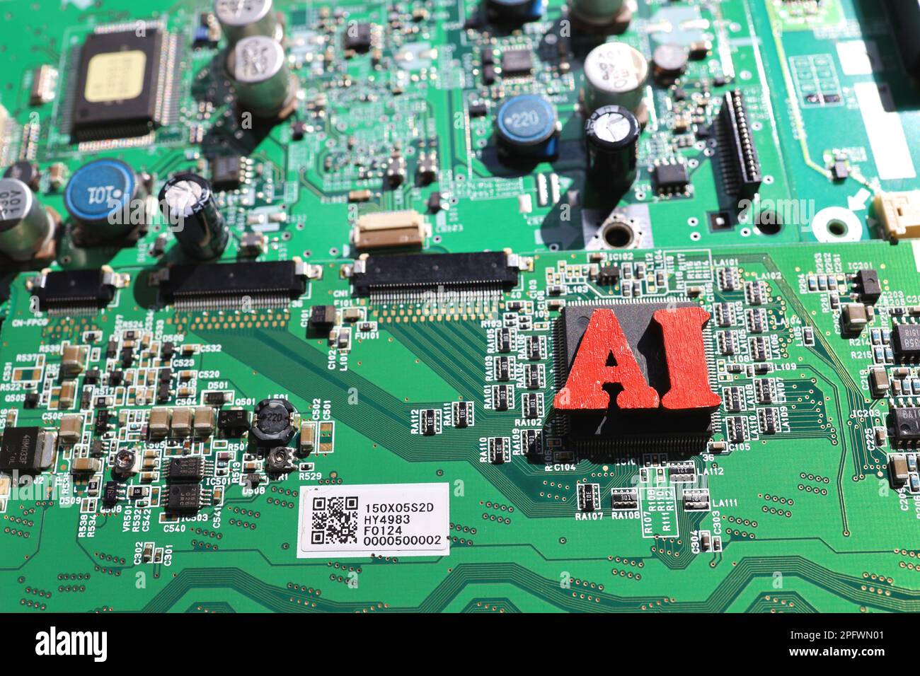 Carte de circuit imprimé semi-conducteur et lettres ai. Concept: Industrie de l'IA et des semi-conducteurs. Banque D'Images