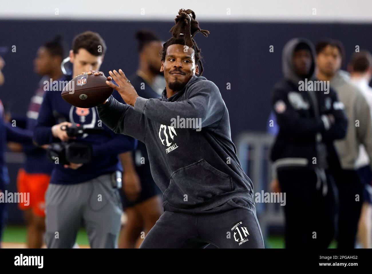 Former NFL and Auburn quarterback, Cam Newton, throws a pass during