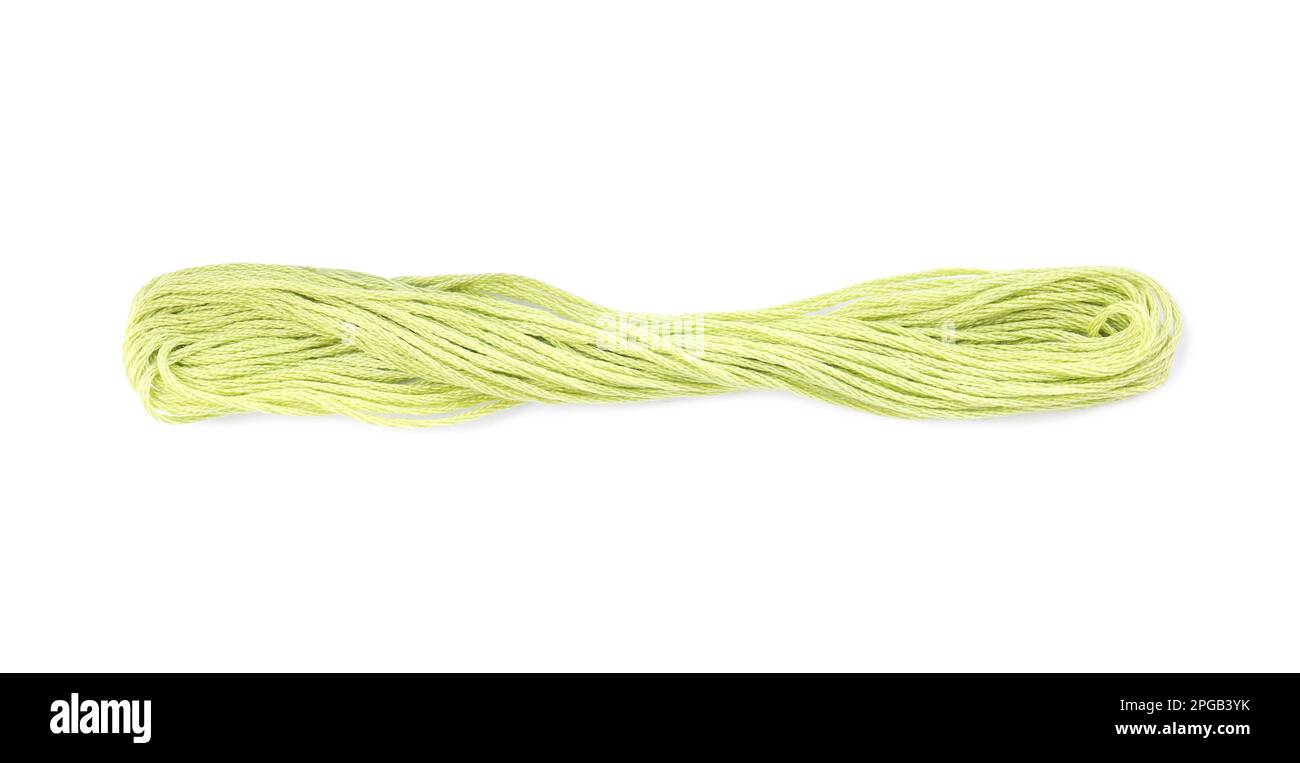 Fil de broderie vert jaunâtre brillant sur fond blanc Banque D'Images