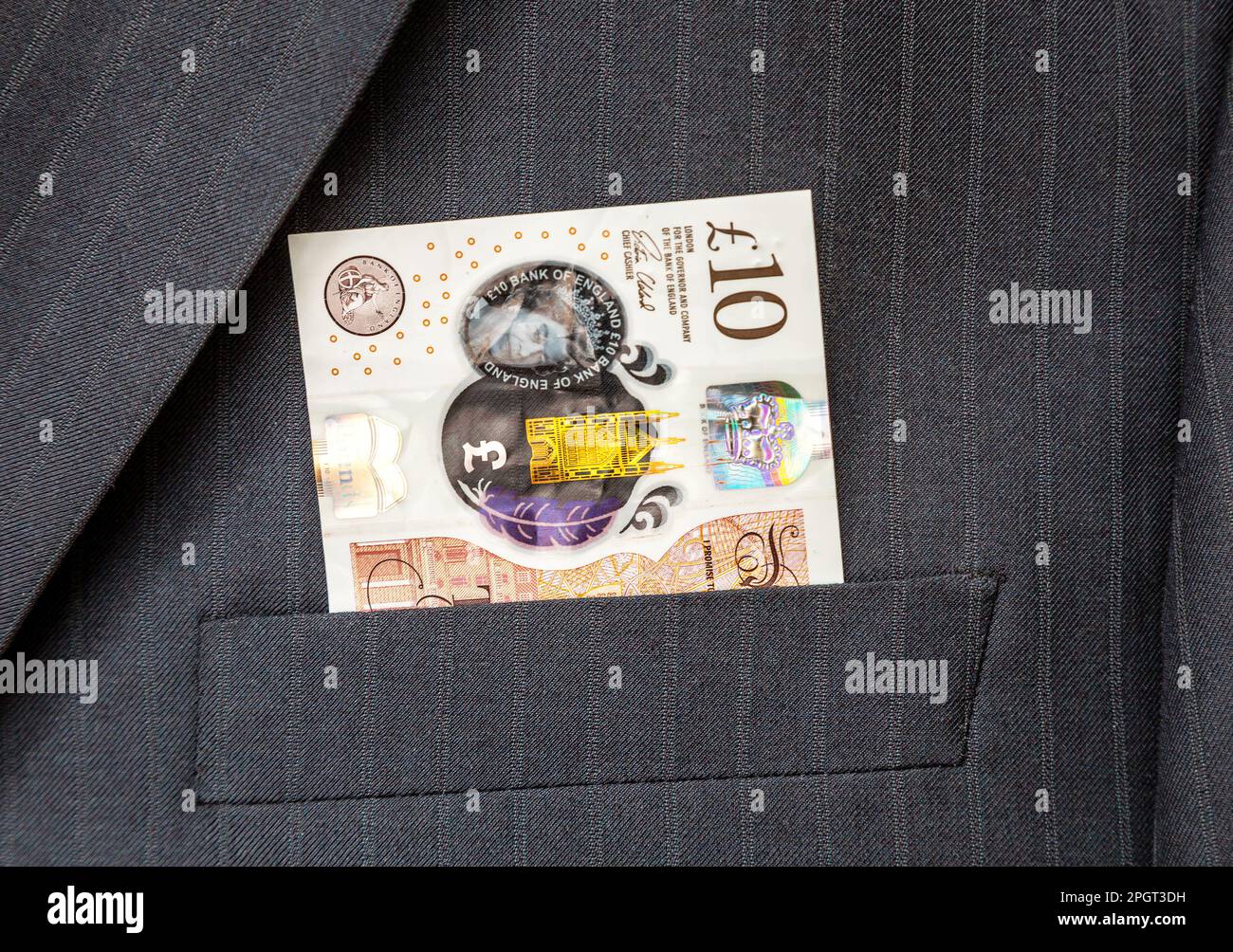 Bank of England 10 livres note de coller hors de la poche de costume Banque D'Images