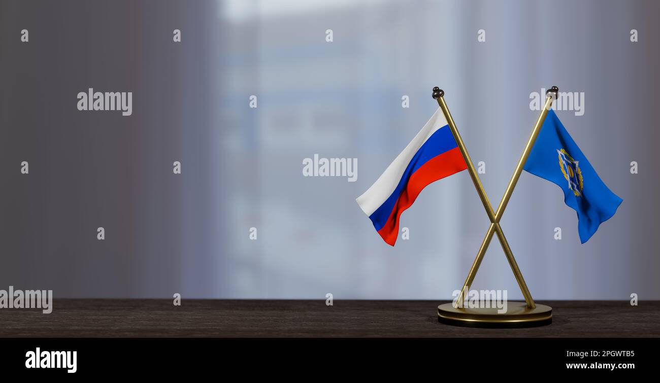 La Russie et les drapeaux de la CSTO sur la table. Négociation entre l'ODKB et la Russie. sur un arrière-plan peu flou. 3D travaux et 3D images Banque D'Images