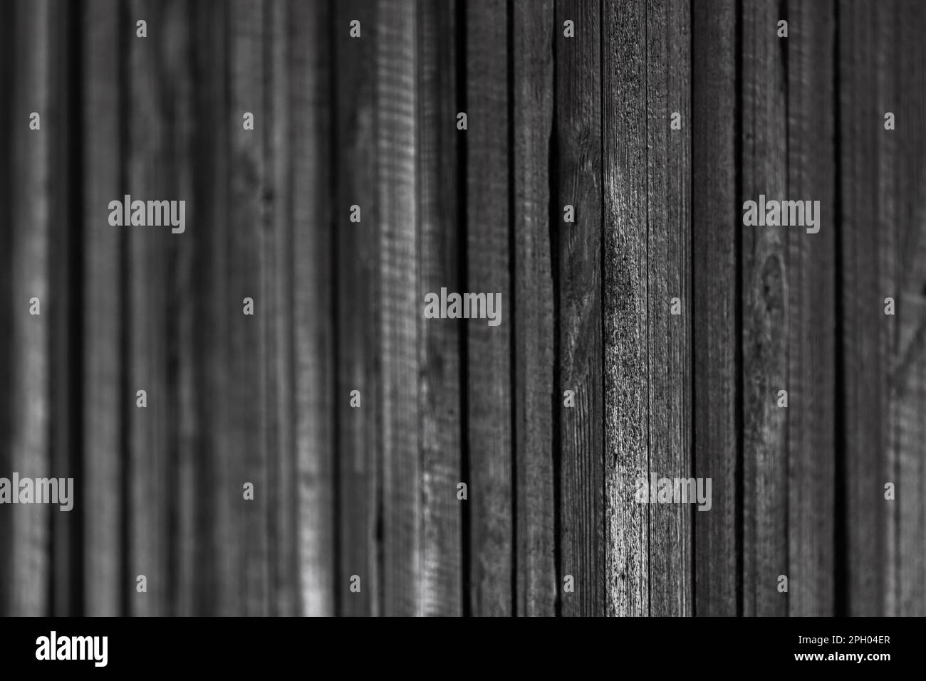 Mur en bois noir, photo d'arrière-plan abstraite avec mise au point douce sélective Banque D'Images