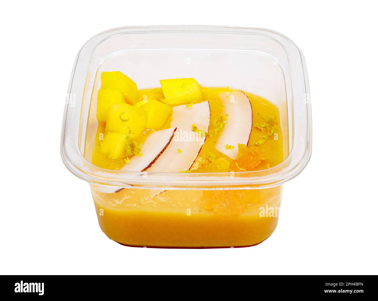 Smoothies aux fruits frais et aux noix. Bol à smoothie, mangue, fruits de la passion, noix de coco. Compote de pommes, zeste de citron. Photo de haute qualité. Banque D'Images