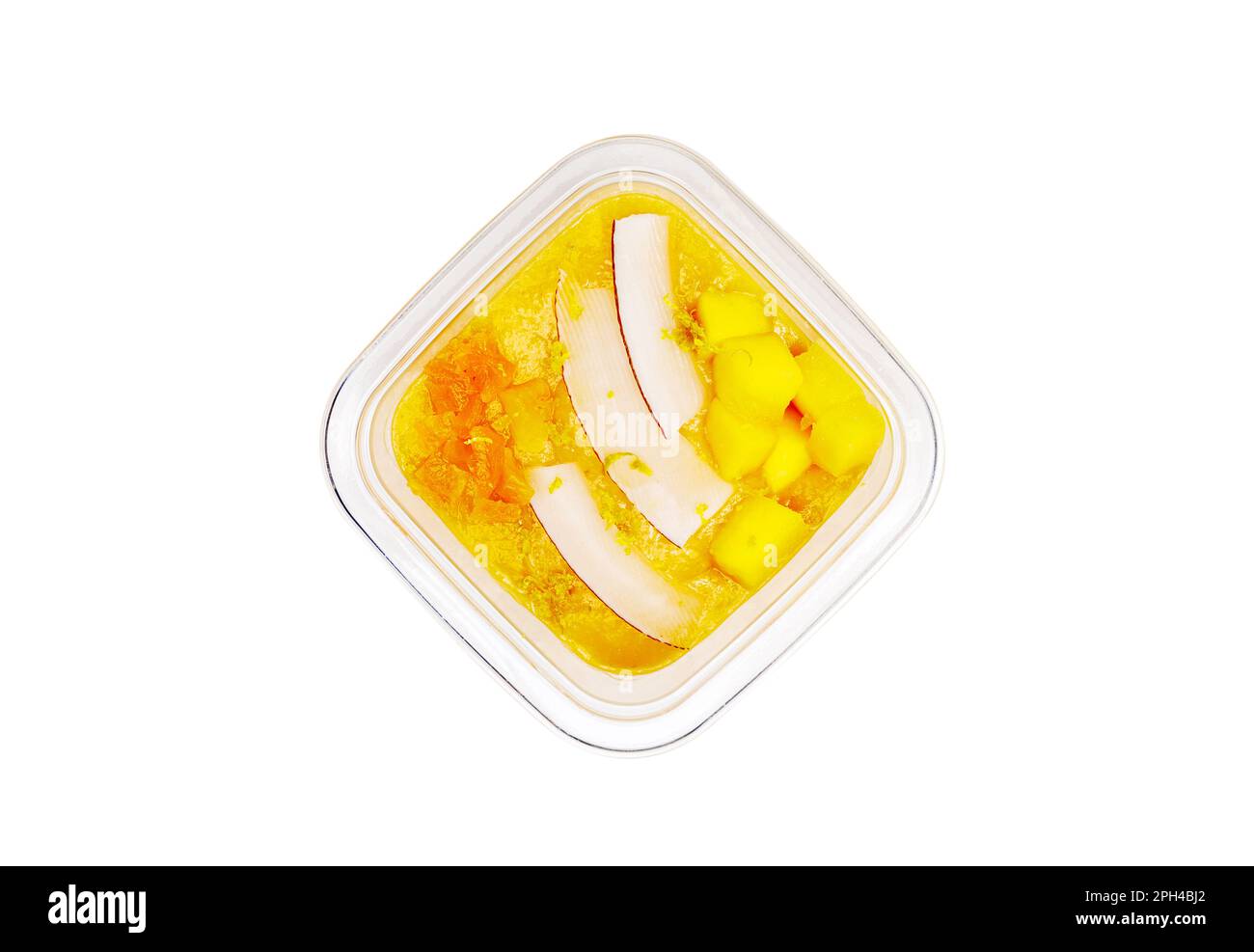 Smoothies aux fruits frais et aux noix. Bol à smoothie, mangue, fruits de la passion, noix de coco. Compote de pommes, zeste de citron. Photo de haute qualité. Banque D'Images