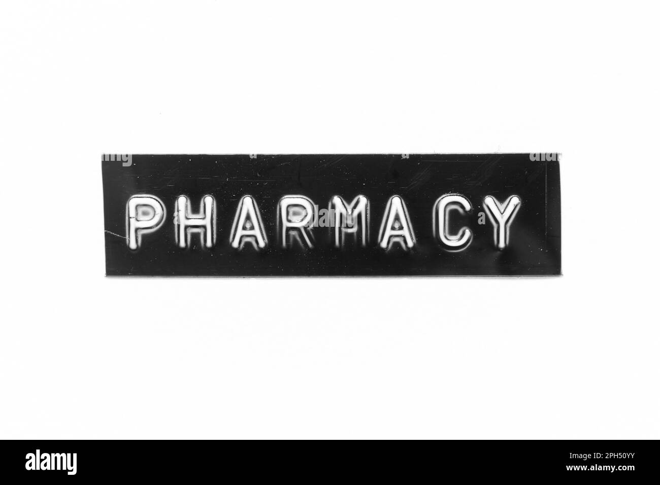 Bannière noire avec lettre en relief et mot pharmacie sur fond de papier blanc Banque D'Images