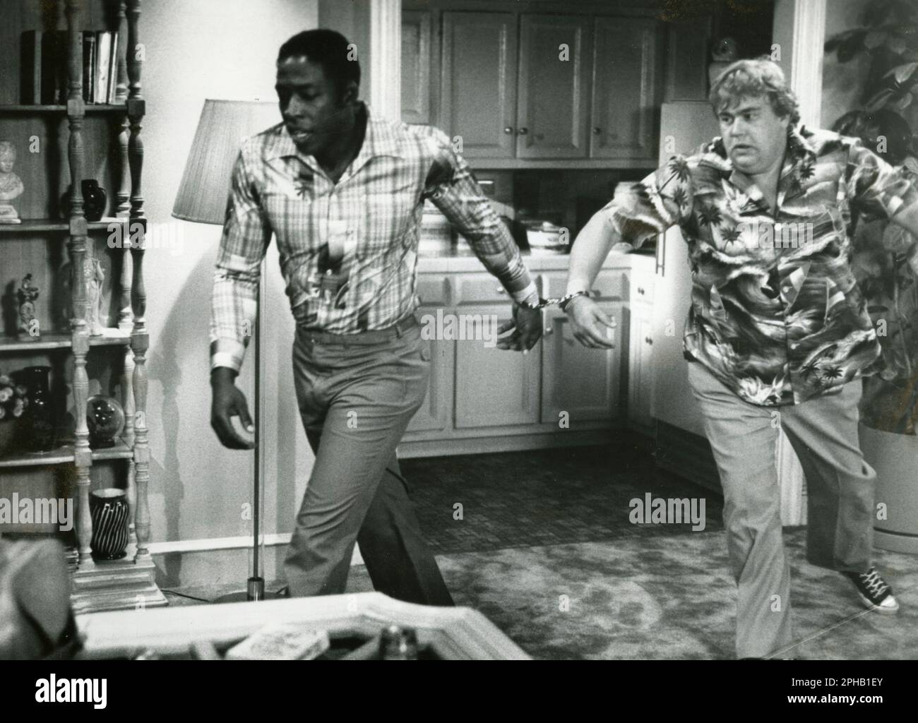 Acteurs Ernie Hudson et John Candy dans le film Going Berserk, USA 1983 Banque D'Images