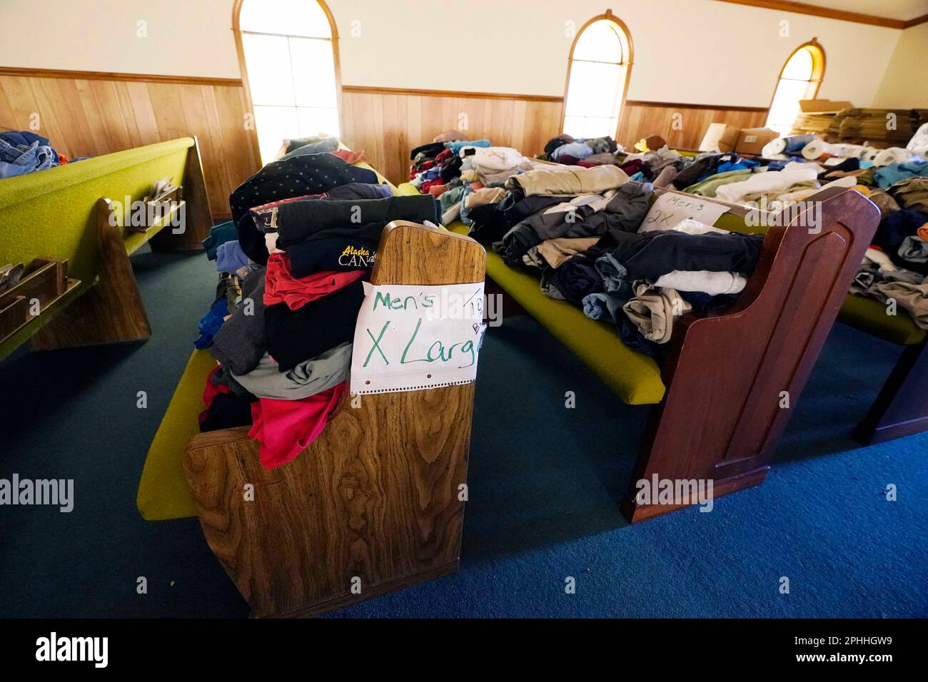 Donated clothing, cleaning, personal and household supplies are placed in the pews of the Greater Little Mt. Zion Missionary Baptist Church in Silver City, Miss., Tuesday, March 28, 2023, for community members who were affected by last Friday's tornado. (AP Photo/Rogelio V. Solis) Banque D'Images
