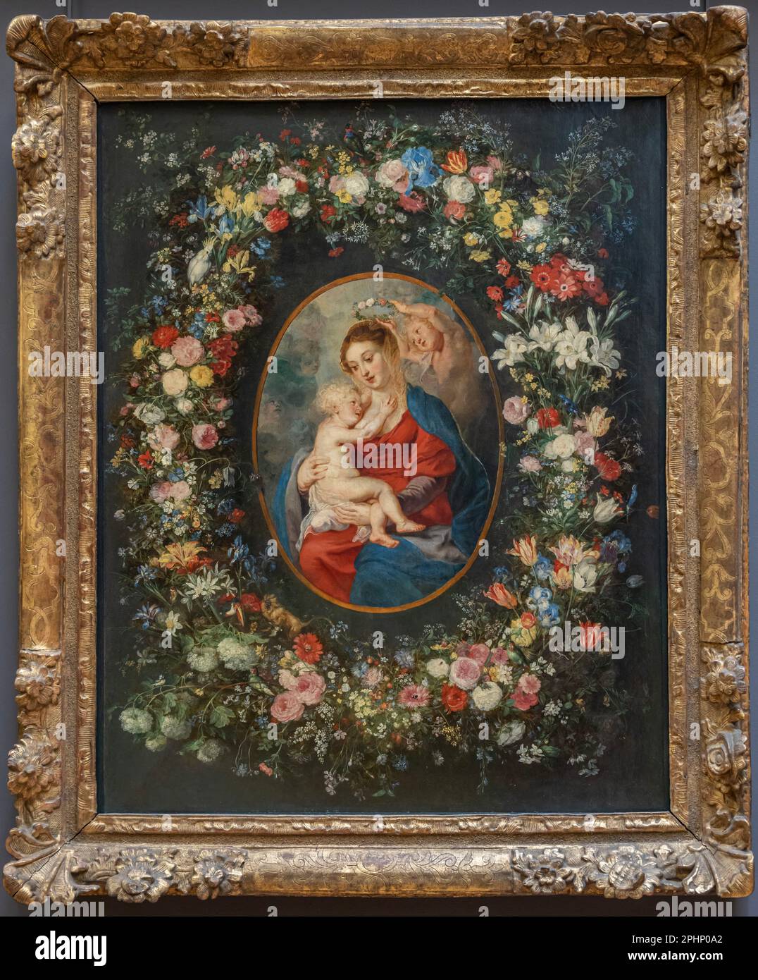 Paris, France - 02 19 2023 : Musée du Louvre. La vierge, l'enfant du Christ et les anges dans une guirlande de fleurs peintes par Jan Brueghel Banque D'Images