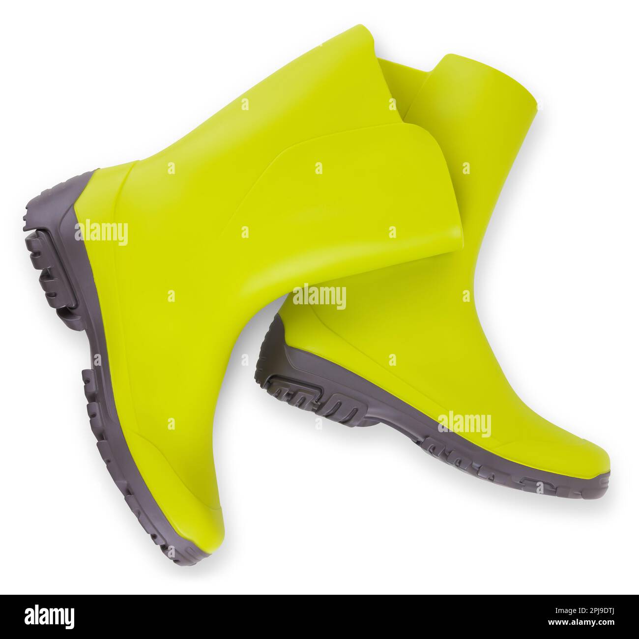 bottes en caoutchouc vert, vue de dessus isolée sur fond blanc avec passe-cheveux, concept de ressort pour le jardinage à la maison ou le potager et le soin des plantes. Al Banque D'Images