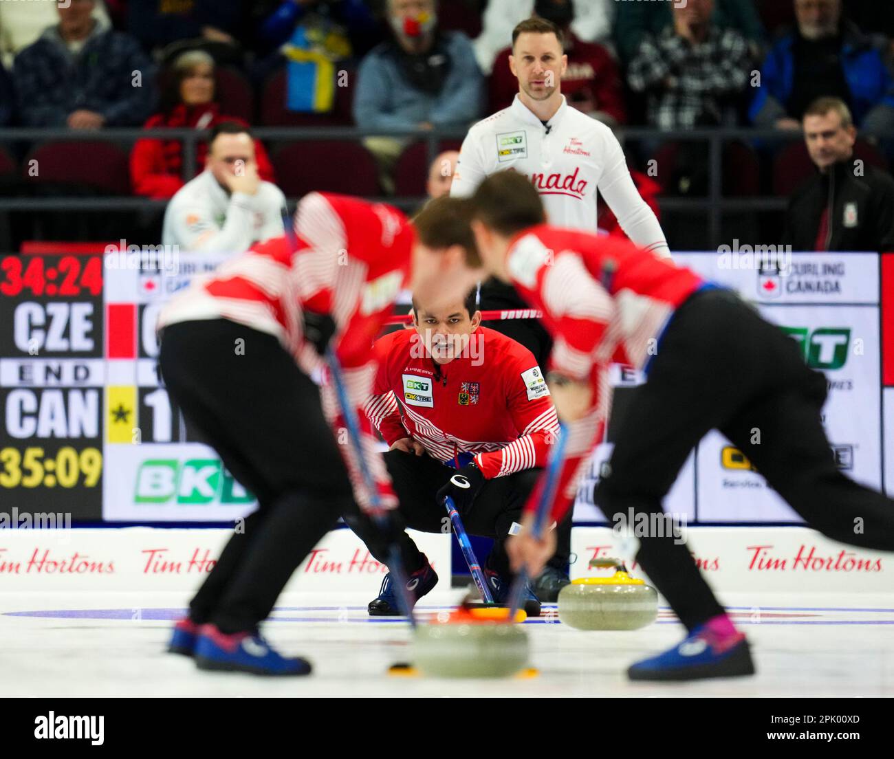 Czech Republic skip Lukas Klima calls the sweep as Canada skip Brad