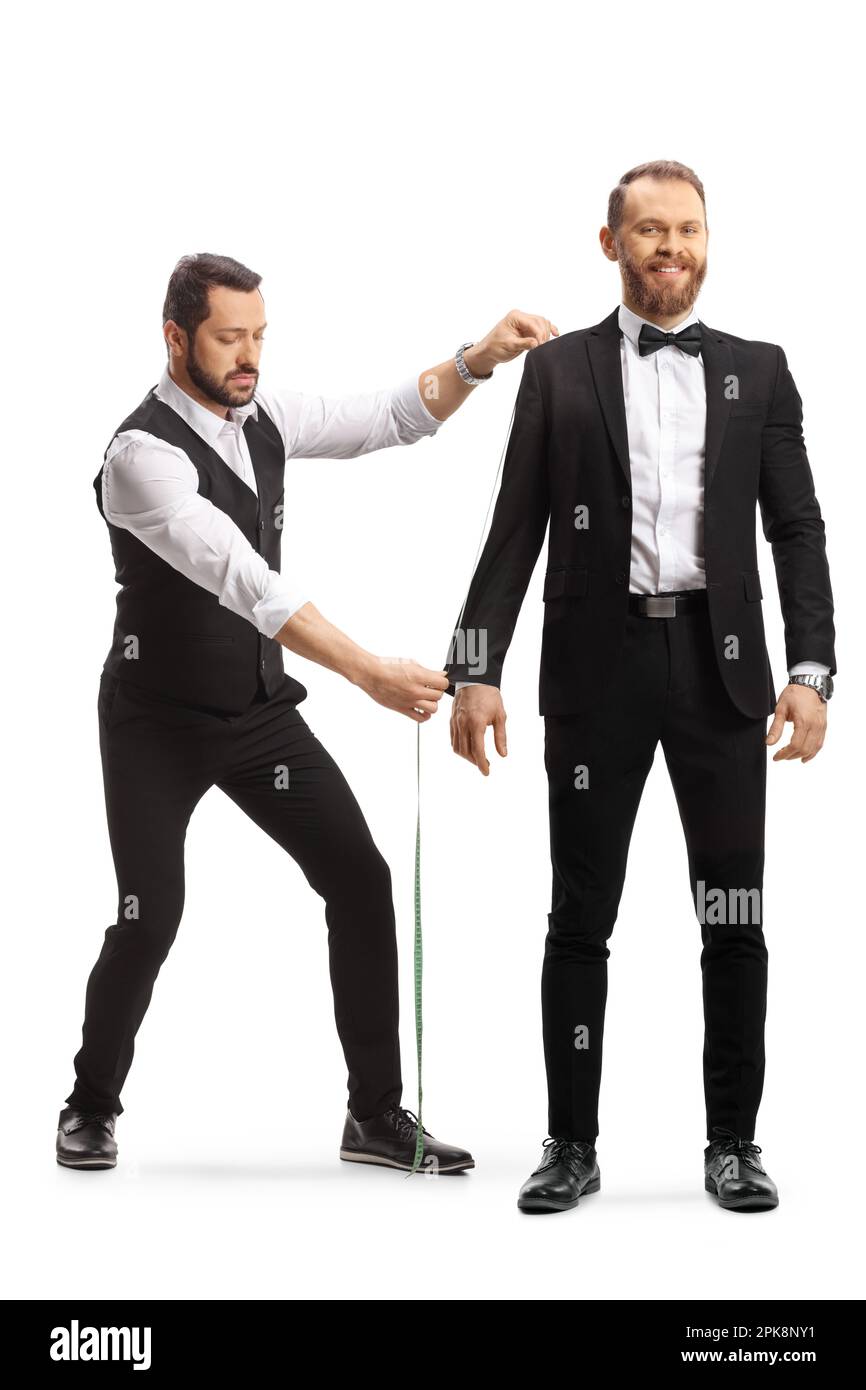 Tailleur mesurant un homme en costume et noeud papillon isolé sur fond blanc Banque D'Images