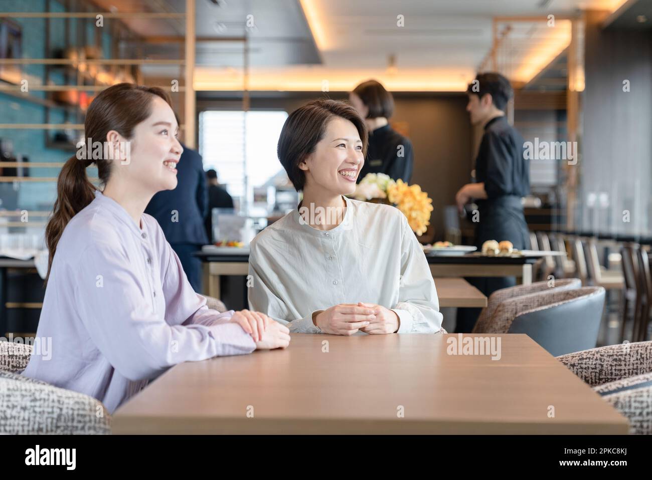 Une cliente qui prend place Banque D'Images