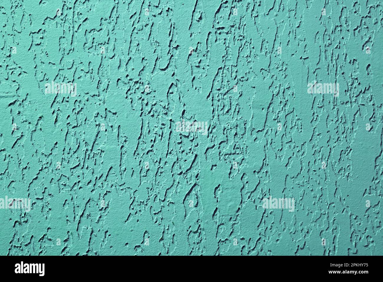 Vue avant du mur en béton bleu sarcelle à motif abstrait Banque D'Images