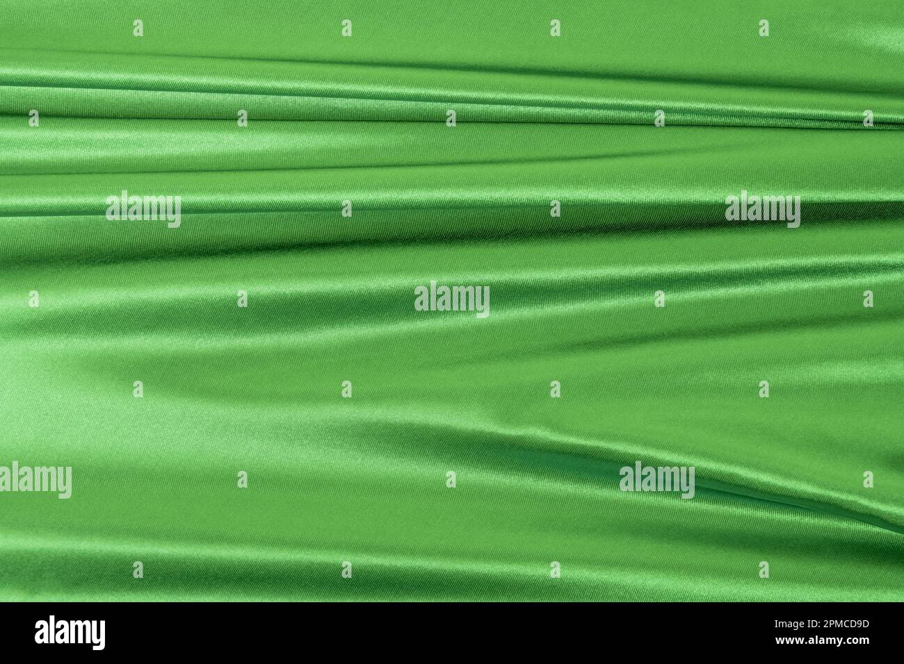 Un tissu vert satiné. Arrière-plan de texture de tissu vectoriel Banque D'Images