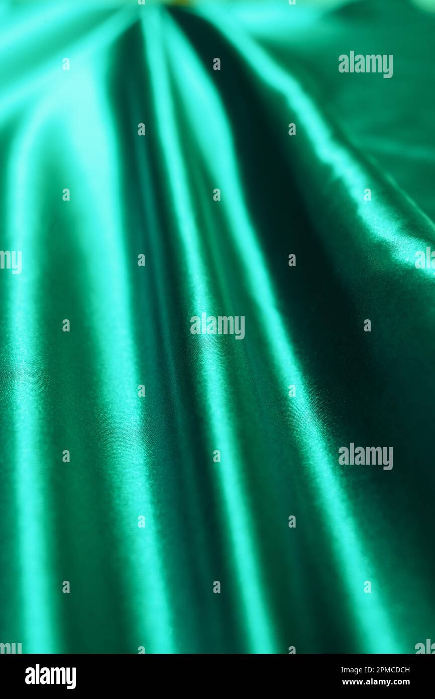 Un tissu satiné vert brillant avec l'eau, le fond de texture de tissu Vector Banque D'Images