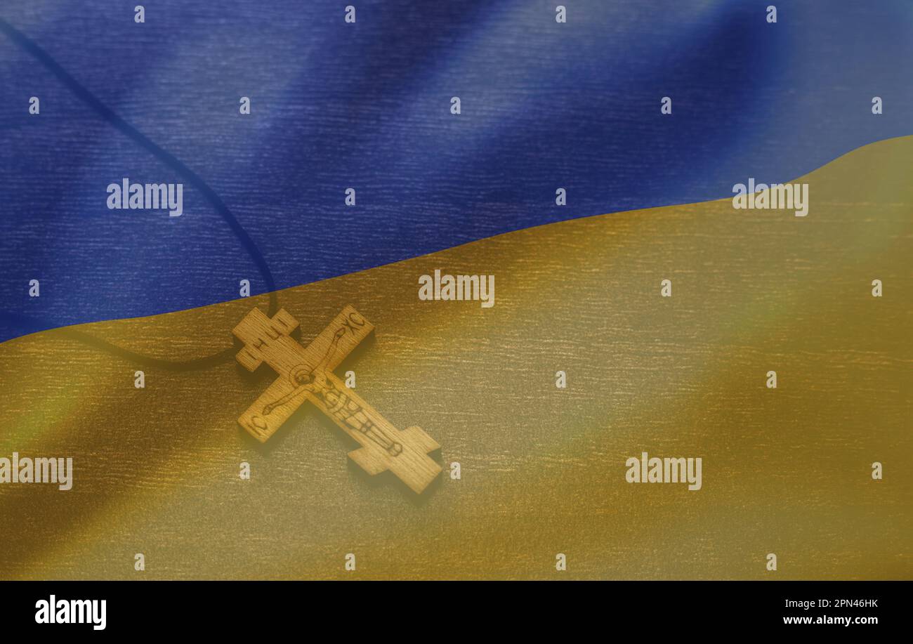 Croix sur le fond du drapeau ukrainien. Priez pour l'Ukraine, drapeau de l'Ukraine. La Russie contre l'Ukraine arrêtent la guerre. Priez pour l'Ukraine, drapeau de l'Ukraine. Banque D'Images