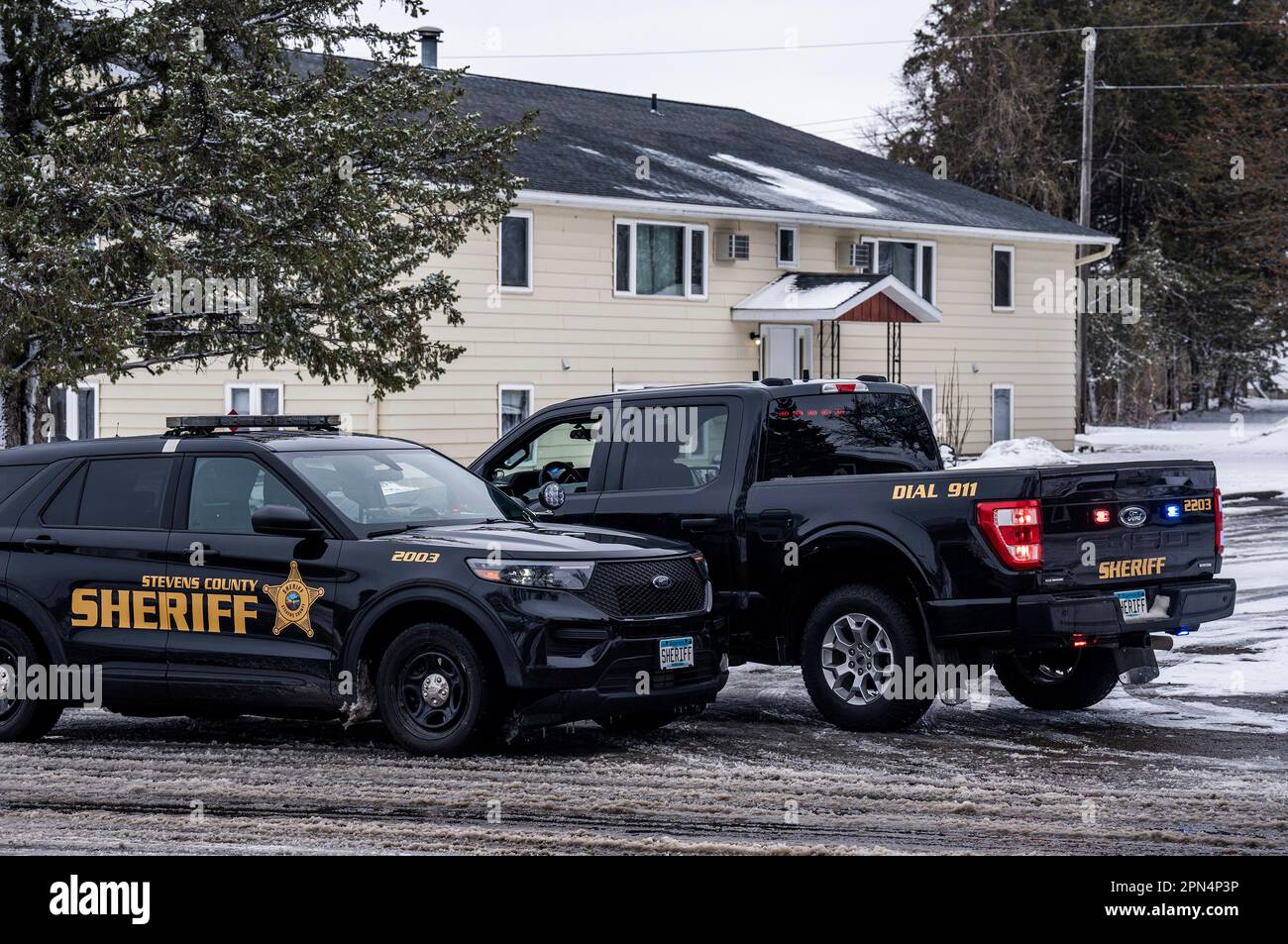 Police keep an eye outside the apartment complex, on Sunday, April 16