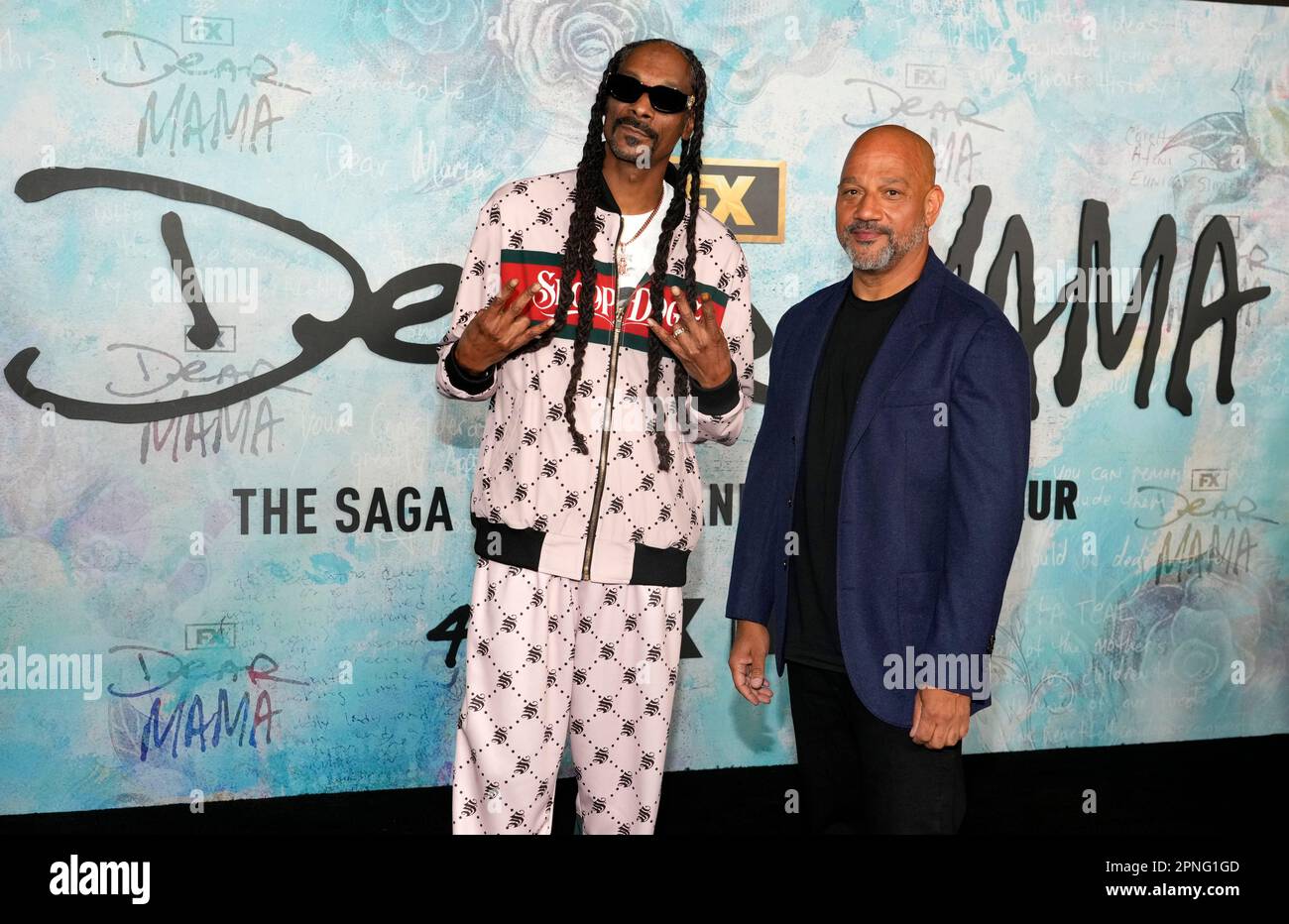 Allen Hughes, right, the executive producer/writer/director of "Dear Mama," poses with rapper Snoop Dogg at the premiere of the FX docuseries, Tuesday, April 18, 2023, at The Ted Mann Theater in Los Angeles. The series explores the legacies of rapper Tupac Shakur and his mother Afeni. (AP Photo/Chris Pizzello) Banque D'Images