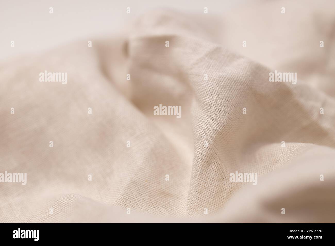 Texture naturelle du tissu de lin. Arrière-plan en toile de fond rugueux et froissé. Mise au point sélective Banque D'Images