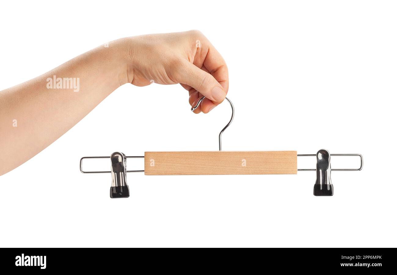 cintre à vêtements dans le chemin de la main isolé sur blanc Banque D'Images