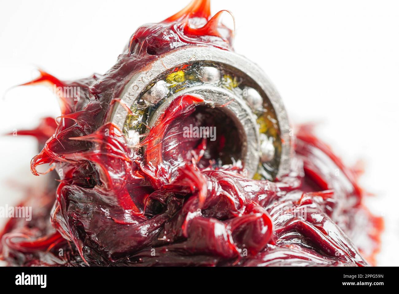 Graisse et roulement à billes, rouge excellente résistance à l'eau graisse synthétique au lithium complexe pour la lubrification des voies mobiles et des machines pour l'automobile et l'industrie. Banque D'Images