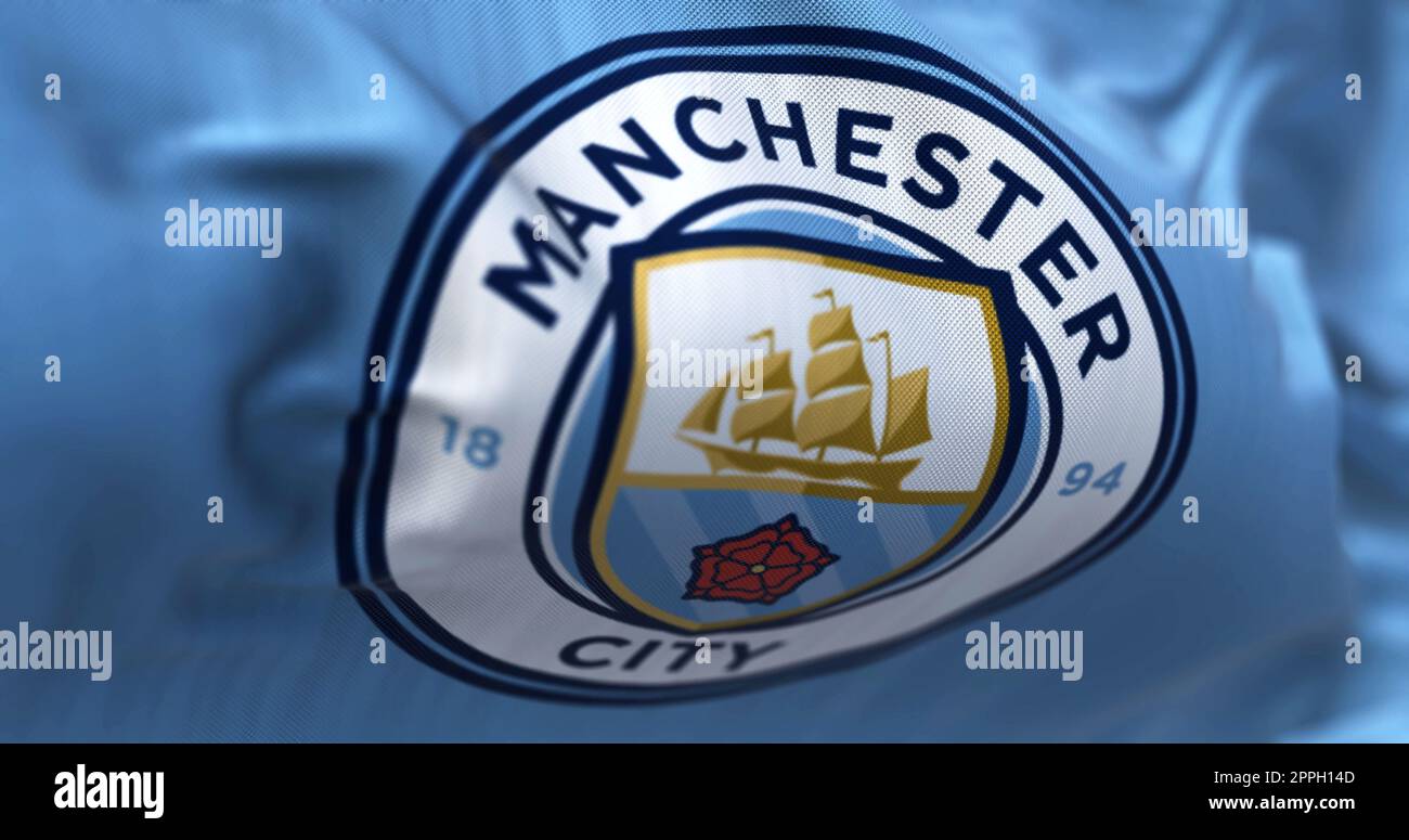 Fond de tissu avec le drapeau de Manchester City ondulant Banque D'Images