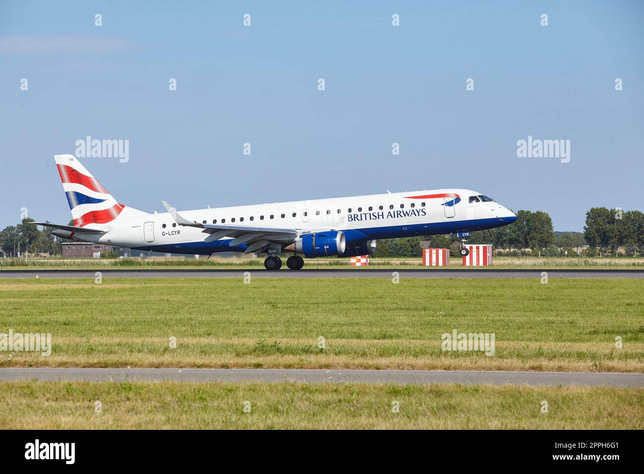 Amsterdam Airport Schiphol - Embraer E190SR de British Airways Cityflyer atterrit Banque D'Images